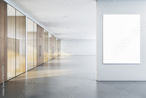 Modern office corridor with a blank white framed poster mockup on a wall  glass partitions and wooden doors  concept of advertising space. 3D Rendering