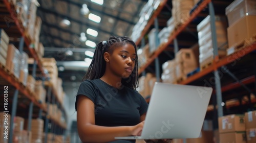 Woman with Laptop in Warehouse © MP Studio