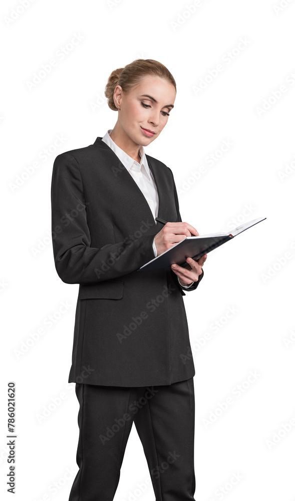 A businesswoman in a suit writing in a notepad, posed isolated on a white background, concept of professional planning A businesswoman in a suit writing in a notepad, posed isolated on a white background, concept of professional planning