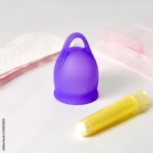 Hygiene Essentials: Purple Menstrual Cup, Tampon, Sanitary Pads, and Liners
