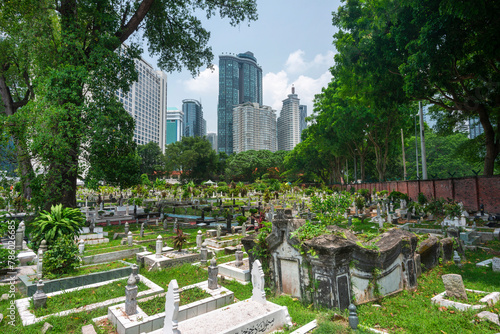Photography Jalan Ampang Muslim Cemetery,in the heart of KL City,overlooked by tall modern buildings,Kuala Lumpur,Malaysia