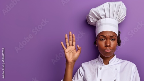 African American girl chef in uniform and hat on purple background with eyes covered and making a stop gesture displaying sadness and fear Implying feelings of embarrassment and negativity