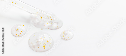 serum pipette serum gel essence texture with gold on white background © Екатерина Клищевник