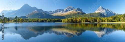 Tranquil high tatra lake with autumn sunrise, mountain reflections, and serene natural beauty