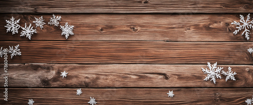 Frame made of snow and snowflakes on rustic brown wood © Random_Mentalist