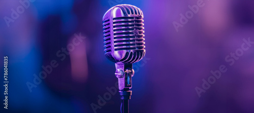 A microphone is on a purple background