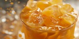 A macro shot of rich, gooey caramel captured in intimate detail within a glass container