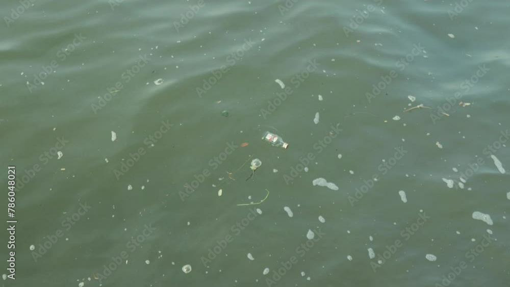 Tropical Indian river in India now masked Polluted and laden with plastic trash, Reminder of human impact on the unsustainable environment. enigmatic contaminated difficult environmental situation. Tropical Indian river in India now masked Polluted and laden with plastic trash, Reminder of human impact on the unsustainable environment. enigmatic contaminated difficult environmental situation.