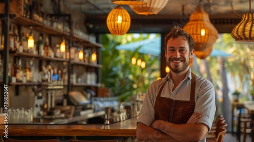 happy bartender professional against the backdrop of his workplace bar in a hotel where many happy tourists are relaxing