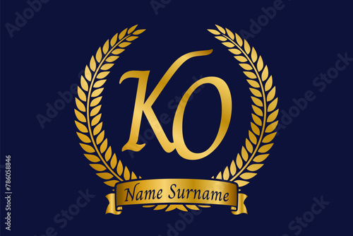Initial letter K and O, KO monogram logo design with laurel wreath. Luxury golden calligraphy font.