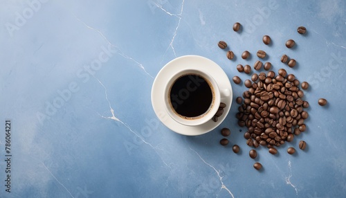 Set of coffee beans and coffee in a cup on a blue marble background