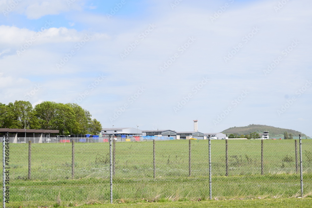 rural airfield in Germany with some planes on the grass
