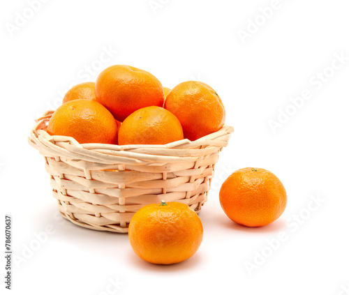 Mandarin in basket isolated on white