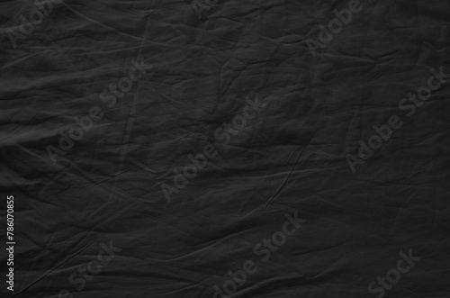 Black crumpled fabric. Background texture.