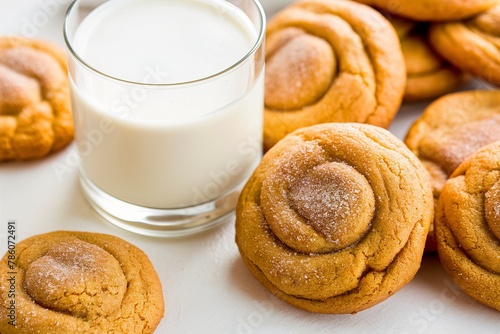 Pumpkin snickerdoodle cookies with cinnamon and a glass of milk photo