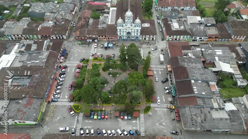 Static aerial view of Parque Bolivar and the church Parroquia Inmaculada Concepción de Filandia in the Andean town of Filandia in the Quindío department of Colombia photo