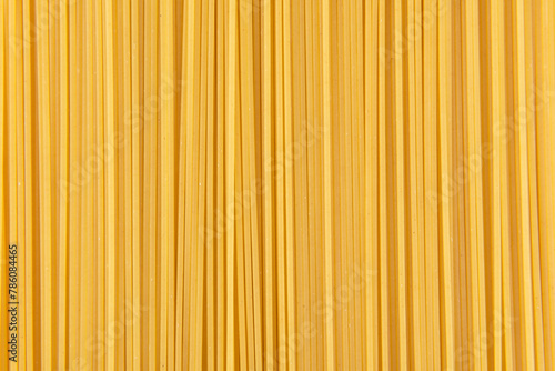 Raw dry spaghetti italian pasta texture background.