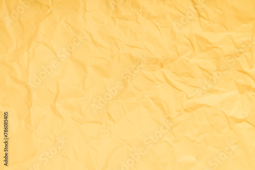 Yellow crumpled paper texture background with space paper for text.