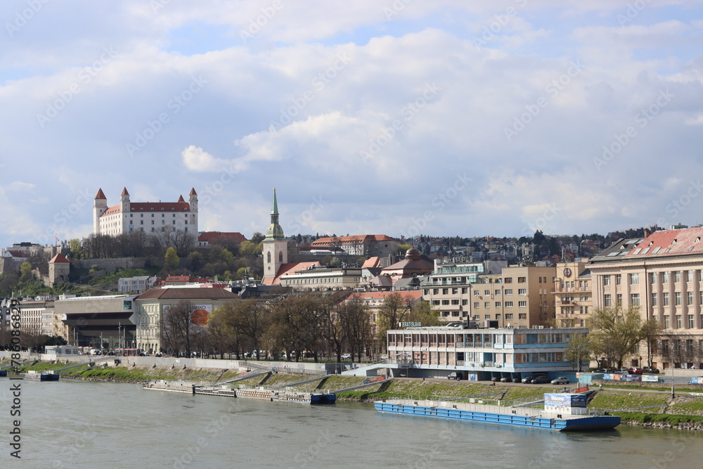 Bratislava old town panoramic view from Danube river. Bratislava castle on cloudy day. European architecture concept. 
