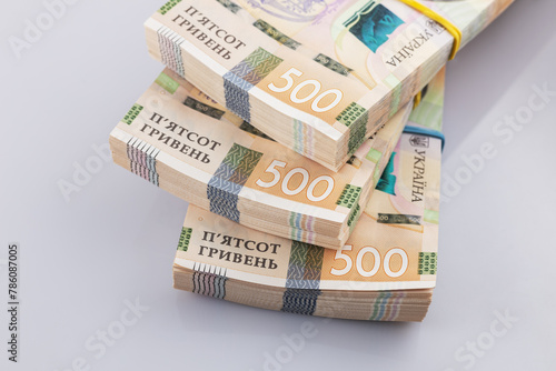 a pack of hryvnias on the table. Financial concept. Ukrainian money. 500 hryvnia on white background