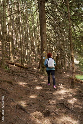 Wallpaper Mural Hiker lady with backpack alone on the trail Torontodigital.ca