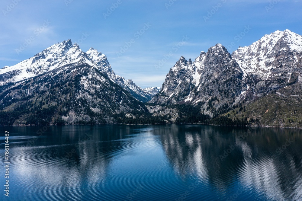 Fototapeta premium View of Lake Jenny and mountains with snowy peaks. Grand Teton National Park, Wyoming, USA.