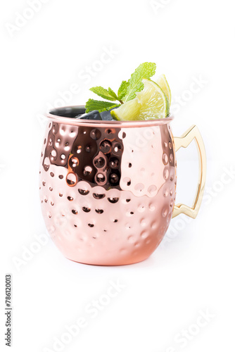 Moscow mule cocktail served with ice and slice of lime isolated on white background