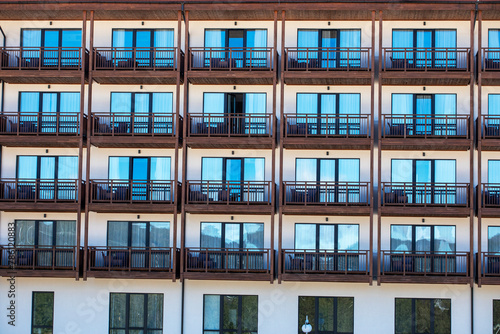 close-up of a building with windows and balconies. construction and mortgage