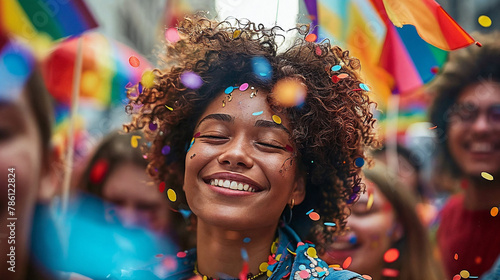 Joyful Woman Celebrating at Pride Parade with Confetti and Flags