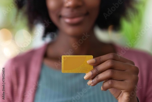 Incentives and Sales: African American Person Holding Prepaid Gift Card photo