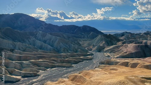 Zabriskie Point Erosion Landscape, Dramatic erosional landscape at Zabriskie Point in Death Valley under a cloudy sky.