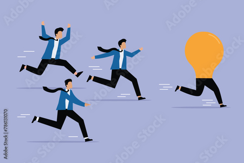Running business people catches up with a light bulb