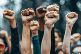 protest and demonstration concept - people hands up in fists