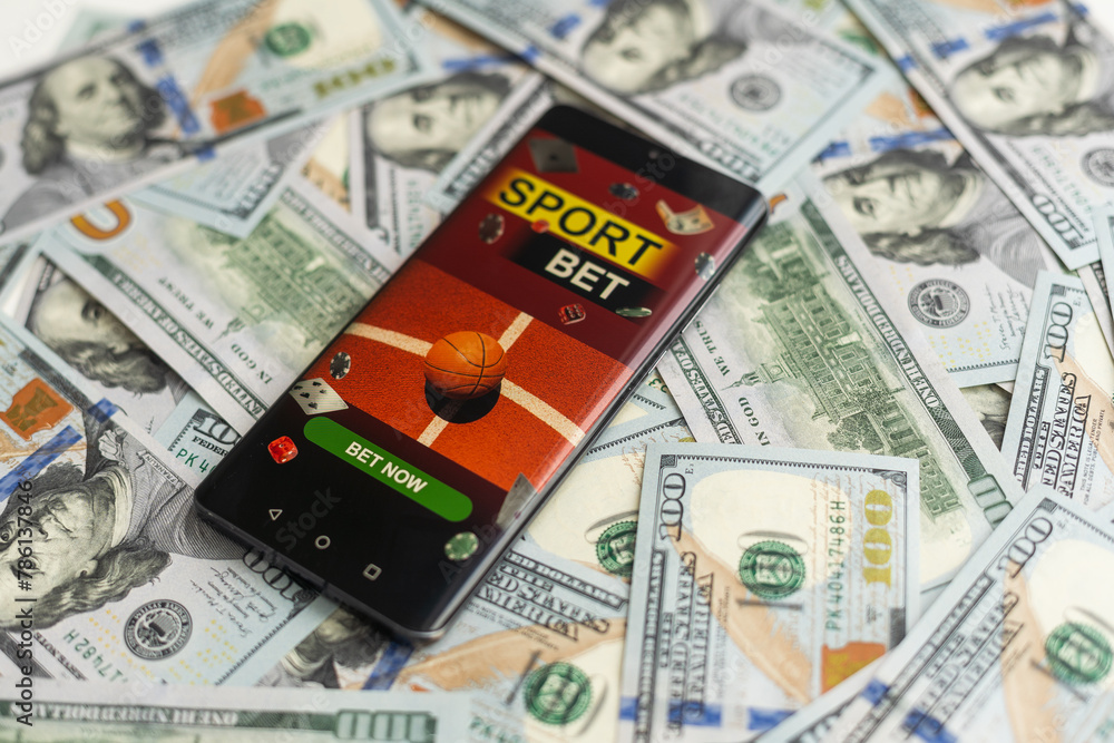 Fototapeta premium betting on sports, smart phone with working online betting mobile application