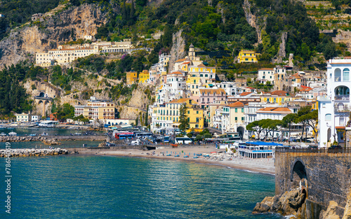 Amalfi on hills leading down to coast, comfortable beach and azure sea in Campania, Italy © IgorZh