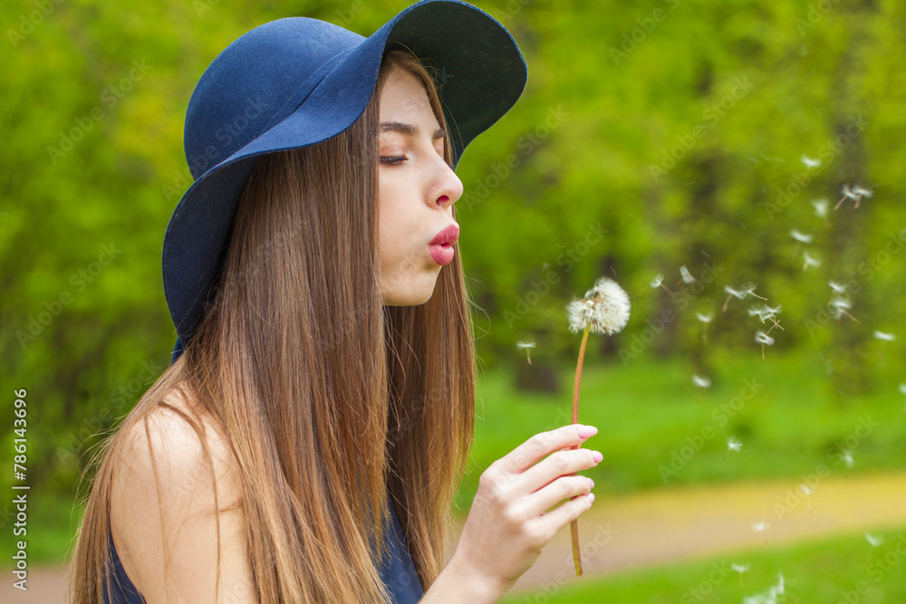 Attractive woman blowing dandelion flower outdoor Attractive woman blowing dandelion flower outdoor