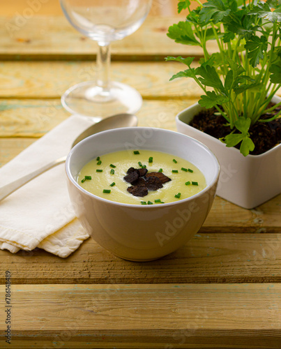 Homemade asparagus soup, seasoned with chives and black truffle...