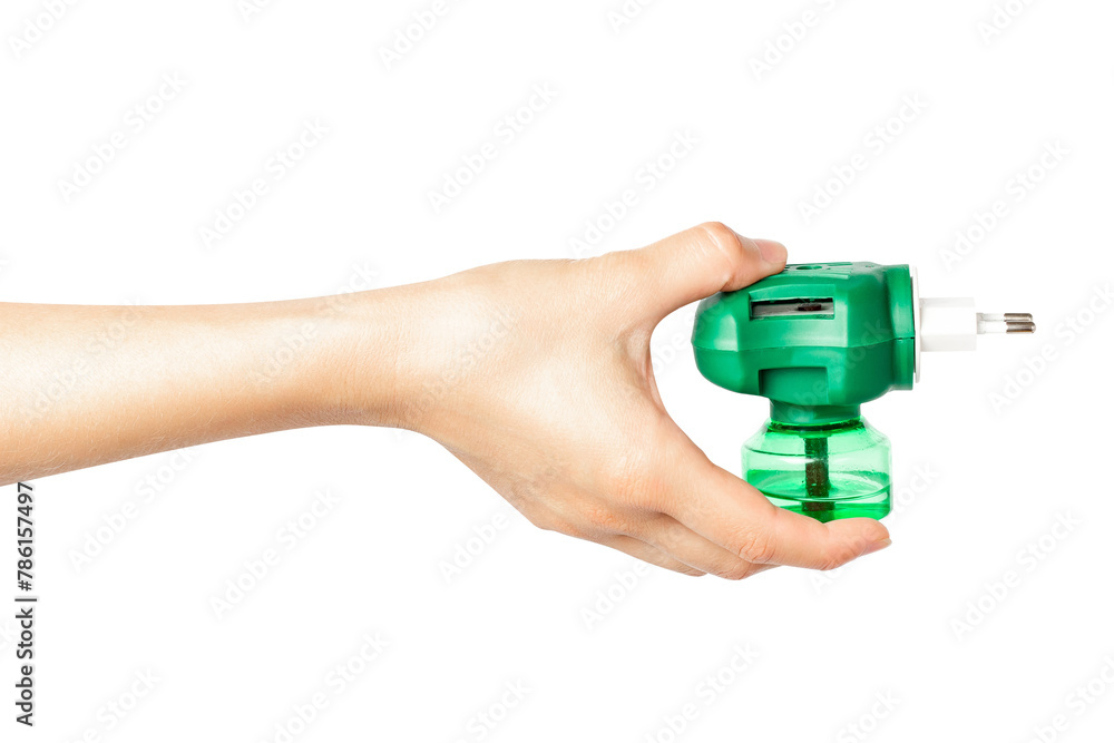 Woman's hand holding a green plug Woman's hand holding a green plug