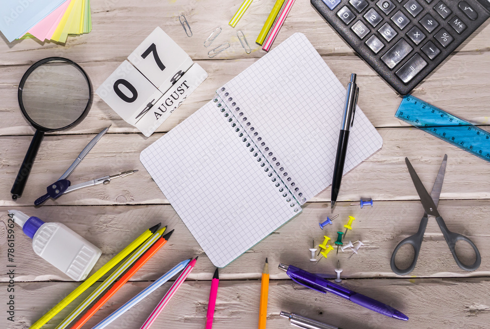 August Notepad August calendar with number 7. Copy of space note. Top view of blank ...