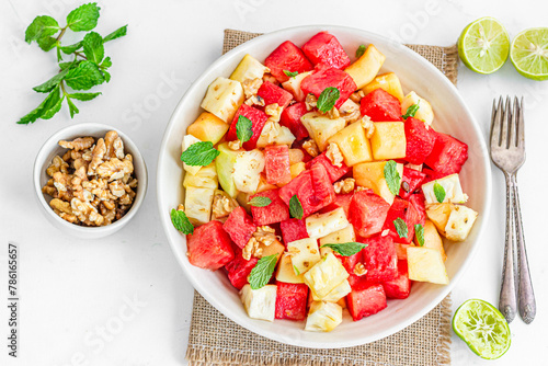 Refreshing and Healthy Watermelon and Pineapple Salad Garnished with Mint Leaves Top Down Healthy food Photography