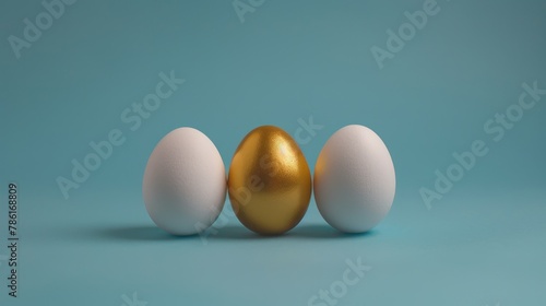 In the center of a blue background, gold egg is surrounded by two white eggs. The concept is exclusivity, individuality, and the best choice.