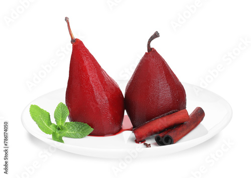 Tasty red wine poached pears with mint and cinnamon isolated on white