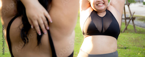Obese two young asian woman doing stretching arm muscle in the park, woman with overweight warm up and exercise for dieting and health, workout and motivation, oversized and challenge, plus size.