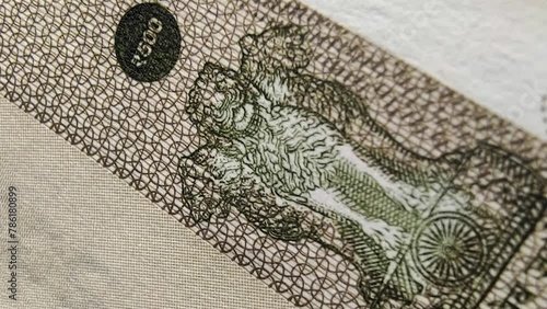 Five hundred rupee indian currency bank note signs and symbols stop motion extreme closeup macro flat lay top view. India inflation, tax, reserve money, economy, banking and investment concept.