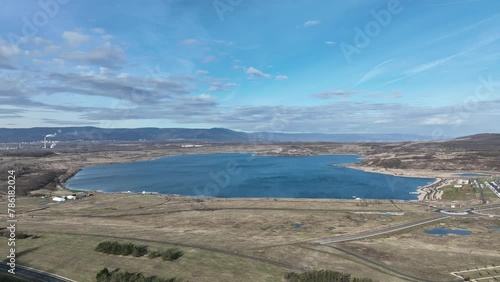 Lignite coal lake Most brown anthropogenic pond water created result reclamation former territory drone aerial Stary Most district city Ustecky Region, mine recreational tourist travel Europe