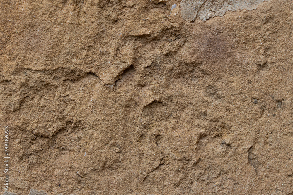 Old textured, weathered masonry wall with abstract pattern, suitable for background. Warm brown colour. Old textured, weathered masonry wall with abstract pattern, suitable for background. Warm brown colour.