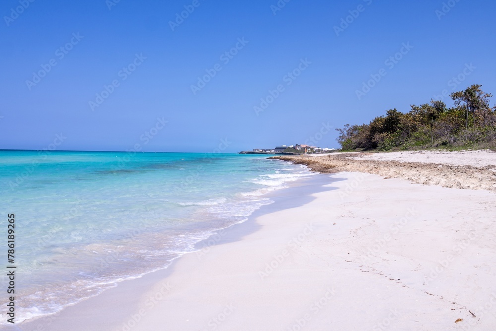 The beautiful beach front of the Cuban town of Varadero in Cuba showing the sandy beach on a sunny summers day