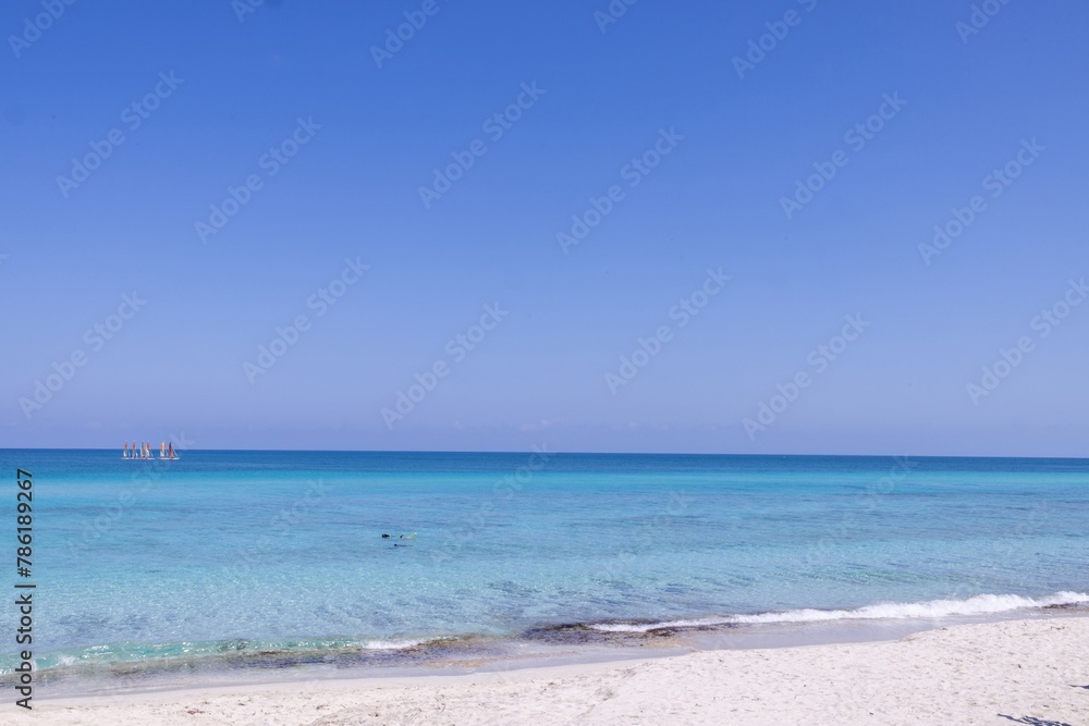 The beautiful beach front of the Cuban town of Varadero in Cuba showing the sandy beach on a sunny summers day