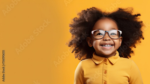 Adorable African American Girl with Big Eyeglasses Radiates Joy and Happiness photo