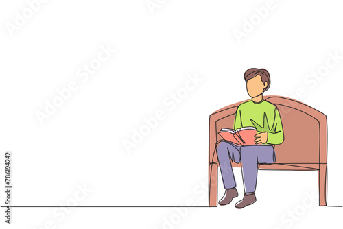 Single continuous line drawing man sitting and reading on chair in university park. Prepare for the final exams with serious reading. Book festival concept. Clever. One line design vector illustration